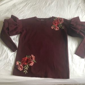 Ruffle Sweater with floral appliqués